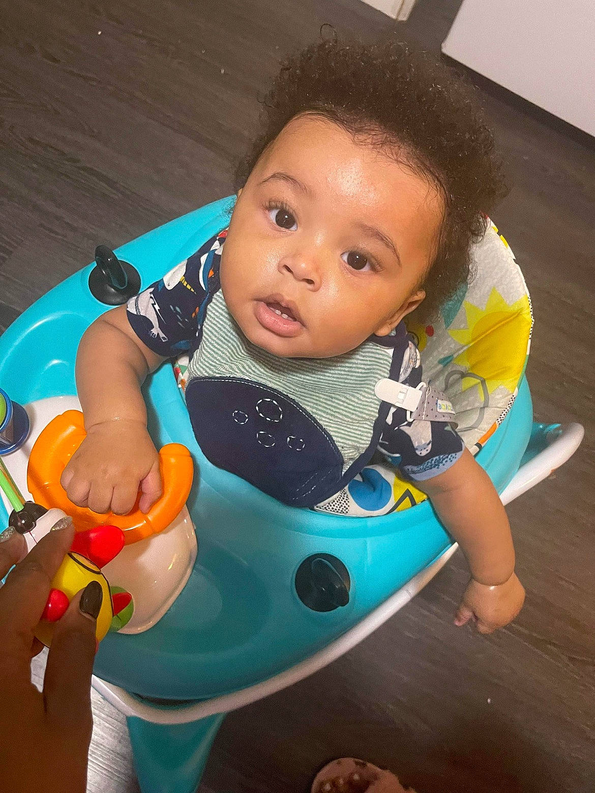 Mayson is registered to the contest to win money with this photo: azure, baby, baby_products, baby_toddler_clothing, baby_toys, child, electric_blue, flooring, fun, hairstyle, head, human_body, leisure, mouth, person, personal_protective_equipment, recreation, sitting, skin, t_shirt