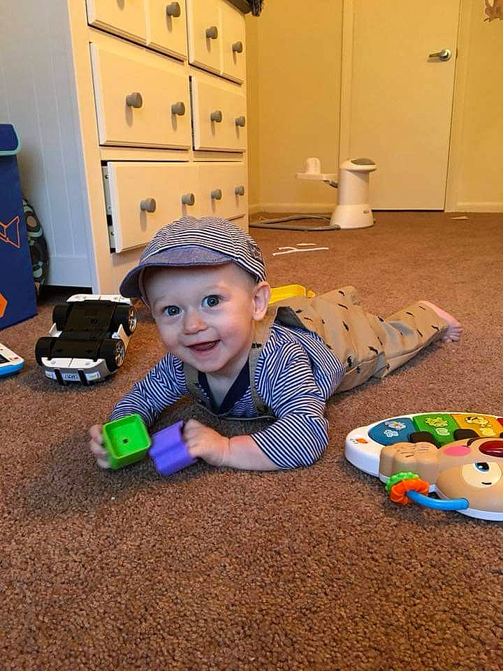 Booker is registered to the contest to win money with this photo: child, day, floor, flooring, fun, girl, headwear, infant, joy, person, play, product, skin, toddler, toy