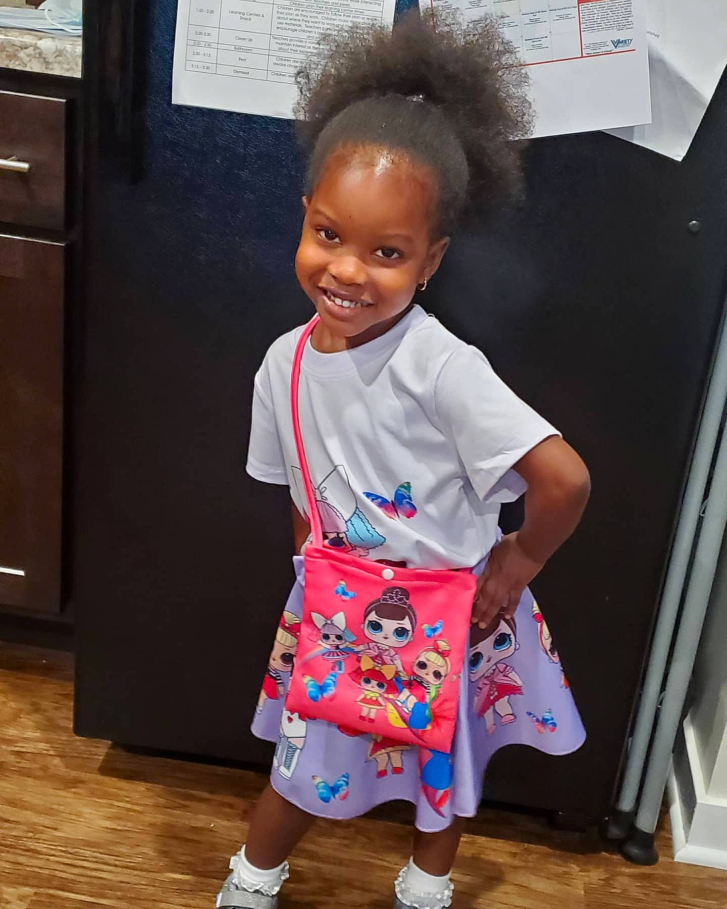 Morgan is registered to the contest to win money with this photo: baby_toddler_clothing, cabinetry, child, door, electric_blue, event, face, fashion_design, flooring, fun, happy, joint, joy, pattern, people, person, sleeve, smile, standing, t_shirt