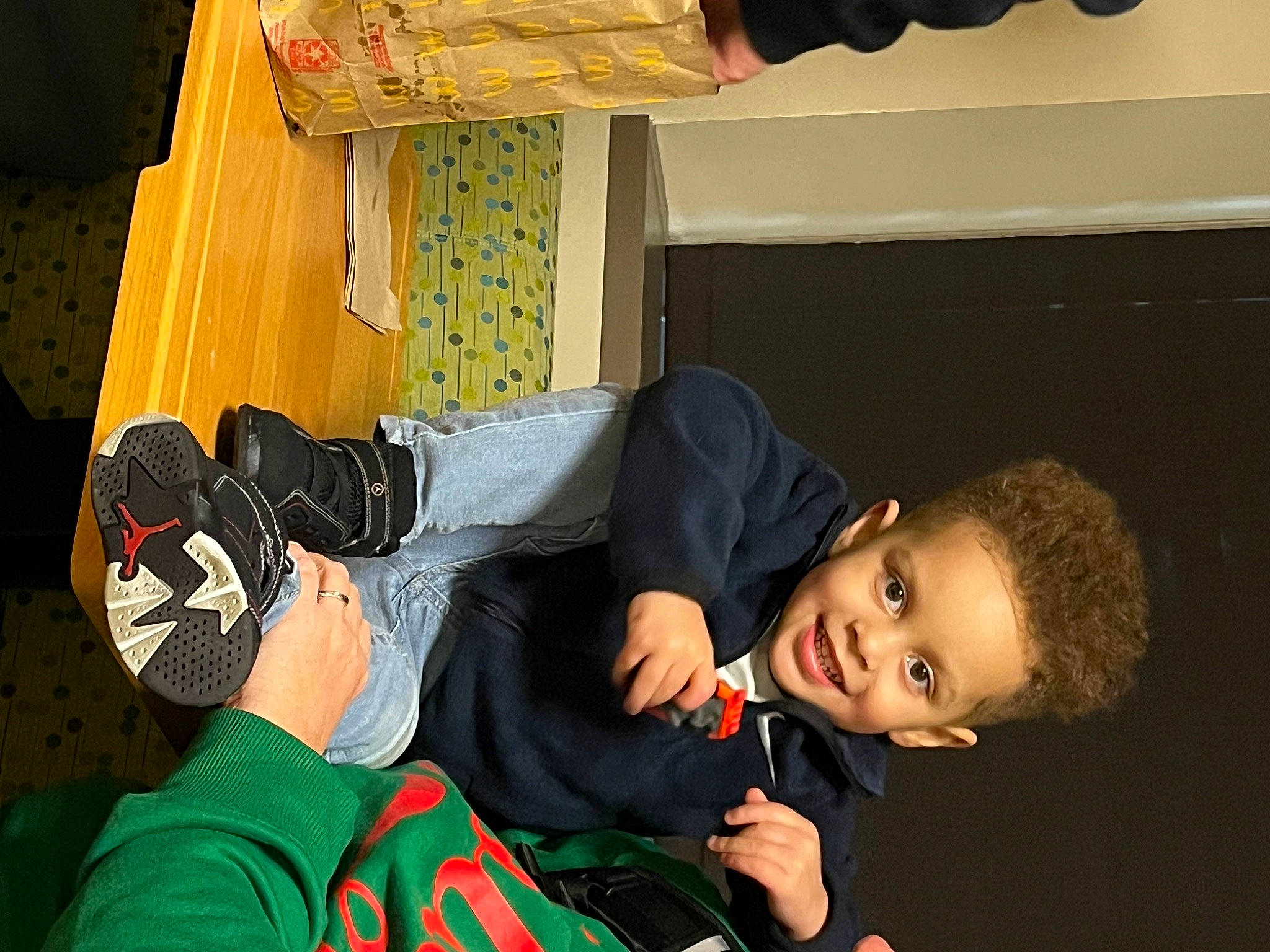 Jaedyn is registered to the contest to win money with this photo: child, comfort, flooring, fun, happy, human_leg, joy, knee, leisure, person, room, sitting, smile, thigh, toddler, walking_shoe