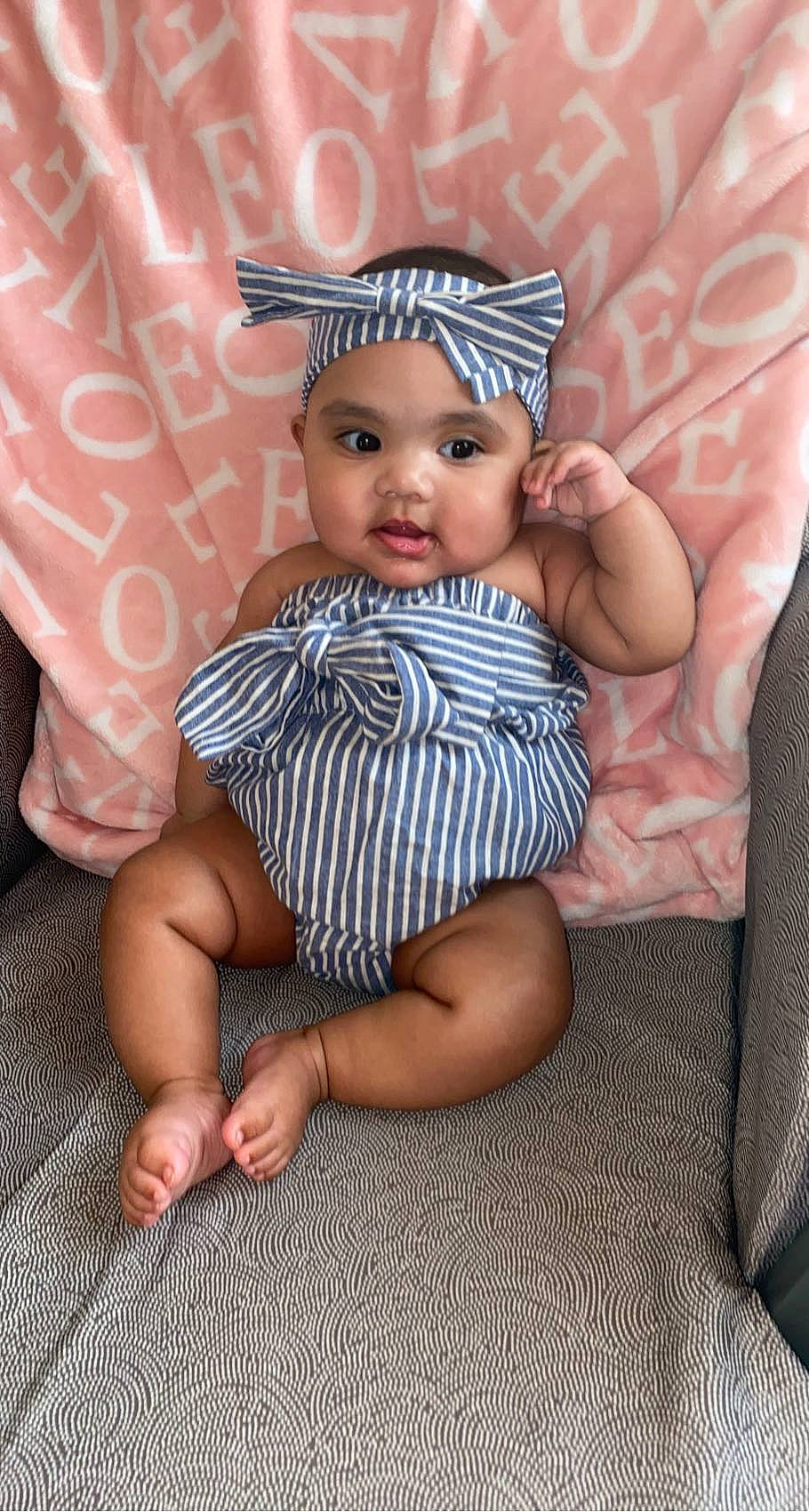 Azjanae joined the competition — help win amazing prizes! baby, baby_toddler_clothing, cheek, comfort, doll, eye, eyelash, fawn, finger, hand, head, headpiece, headwear, iris, lip, pattern, person, pink, skin, textile