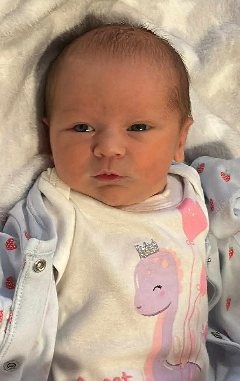Bella-Leigh joined the competition — help win amazing prizes! baby, newborn, infant, face, onesie, clothing, blanket, cute, portrait, closeup, sleepwear, pink, white, soft, child, human, expression, small, head, person