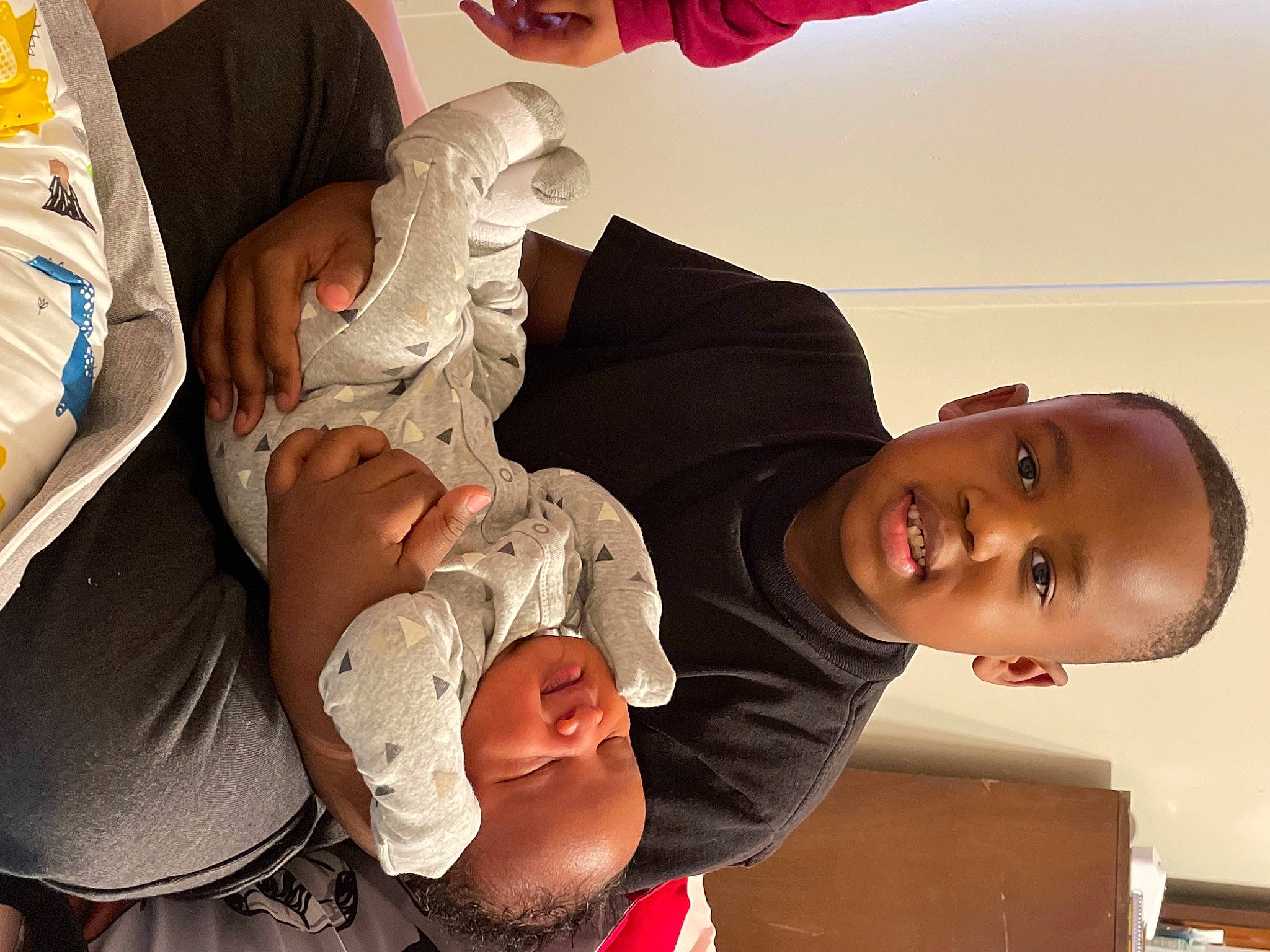 Nathan is registered to the contest to win money with this photo: baby, child, comfort, elbow, event, finger, gesture, hand, happy, health_care, joint, mouth, people, person, product, service, skin, smile, t_shirt, toddler