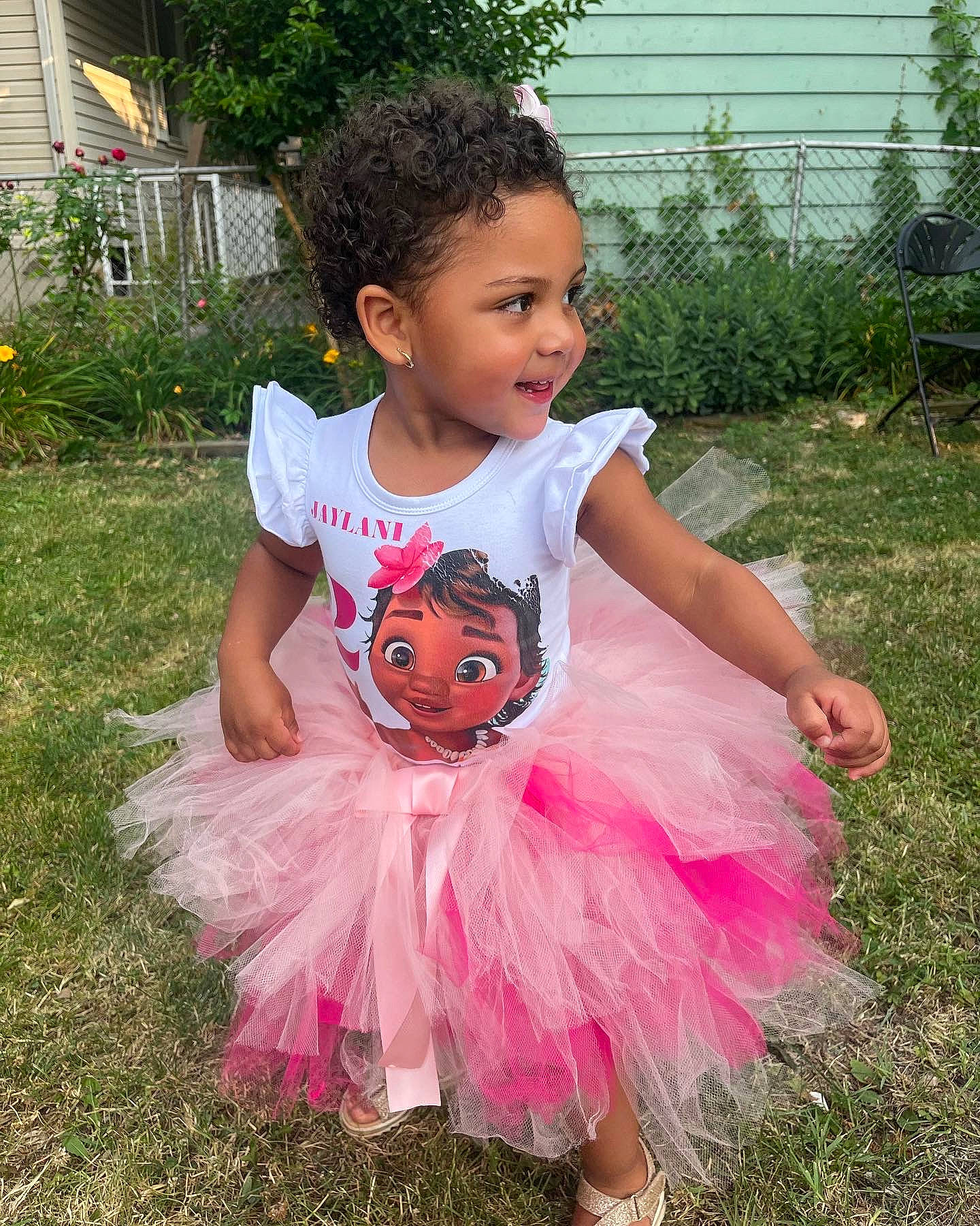 Jaylani is registered to the contest to win money with this photo: baby, baby_toddler_clothing, ballet_tutu, child, costume, event, fun, grass, happy, house, leisure, magenta, person, pink, plant, summer, t_shirt, toddler, trick_or_treat, vacation