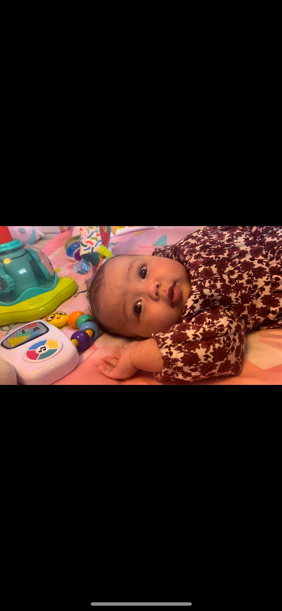 Ariah is registered to the contest to win money with this photo: baby, baby_products, baby_toddler_clothing, baby_toys, cheek, child, flash_photography, flooring, fun, human_body, person, plastic, portrait_photography, room, sitting, toddler, wood