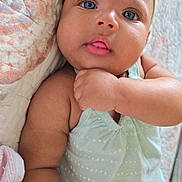 Kalyni is registered to the contest to win money with this photo: baby, infant, child, blue_eyes, headband, mint_green, polka_dot, quilt, close_up, skin, face, hand, cute, adorable, lying_down, soft_light, indoor, portrait, expression, baby_clothes
