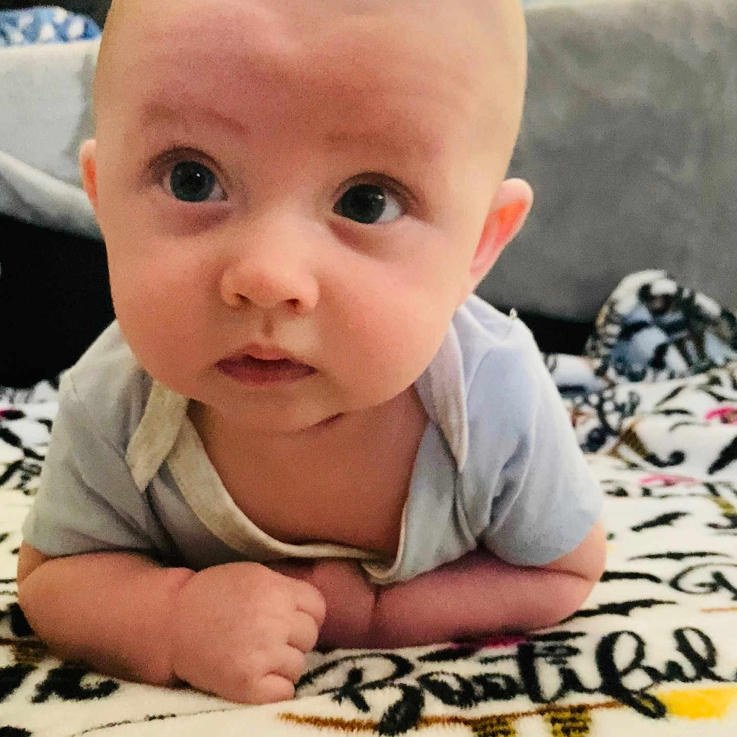 Creed is registered to the contest to win money with this photo: adult, baby, babycrawling, bed, bedroom, crawling, cushion, face, furniture, head, homedecor, indoors, male, man, newborn, person, photography, portrait, quilt, sitting