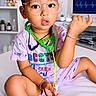toddler, child, glasses, toy_stethoscope, doctor_set, medical_theme, pajamas, sitting, indoor, medical_chart, teddy_bear, certificate, computer_screen, face, hand, expression, young_child, play, cute, education