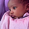 baby, child, close_up, clothing, curious, cute, expression, face, head, indoors, infant, newborn, person, pink_blanket, portrait, seat, skin, sleeping_bag, soft_lighting, young