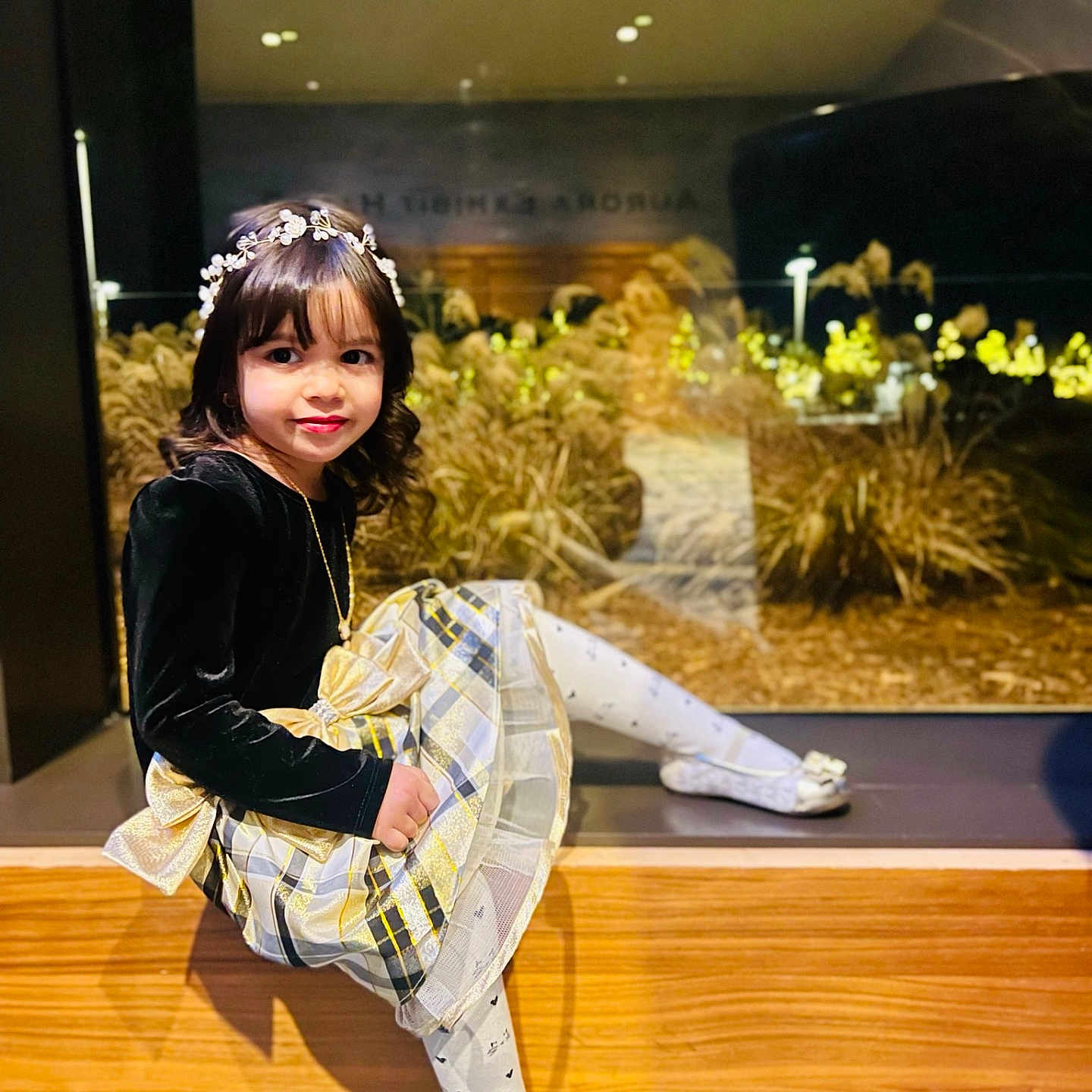 Celia joined the competition — help win amazing prizes! child, clothing, face, female, footwear, girl, hardwood, head, indoors, interiordesign, lighting, pants, person, photography, plant, portrait, pottedplant, shoe, sitting, wood