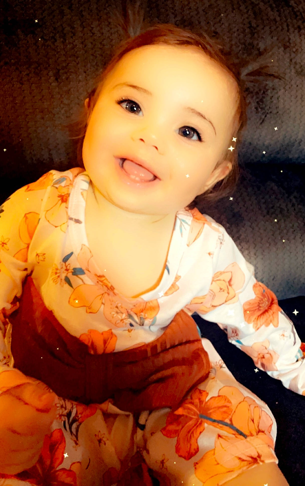 Raelynn is registered to the contest to win money with this photo: baby_toddler_clothing, cheek, chin, dress, eye, face, flash_photography, forehead, happy, head, human_body, iris, joy, lip, mouth, neck, nose, orange, person, skin