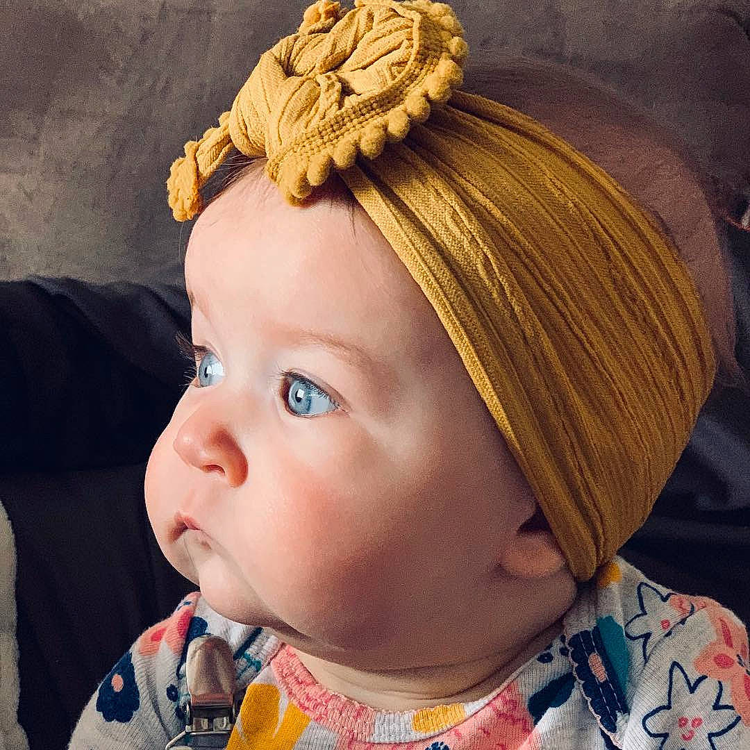 Aislynn is registered to the contest to win money with this photo: baby, cheek, child, chin, clothing, cool, ear, face, fashion_accessory, forehead, hair, hair_accessory, hairstyle, head, headband, headgear, lip, organ, person, toddler