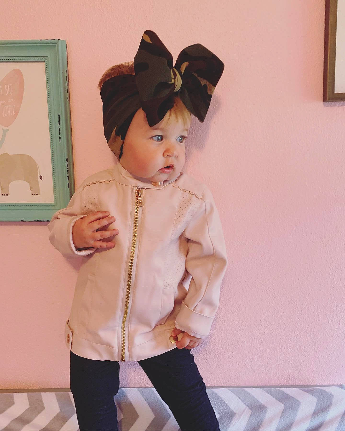 Aislynn is registered to the contest to win money with this photo: baby, baby_toddler_clothing, child, ear, fur, headgear, jacket, outerwear, person, pink, sleeve, toddler