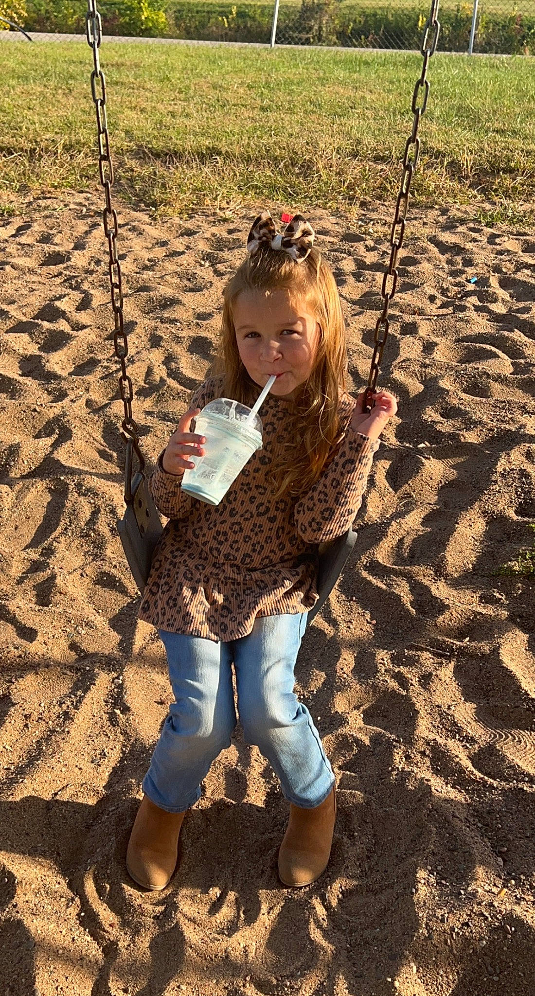 Aislynn is registered to the contest to win money with this photo: child, city, cool, fun, grass, happy, landscape, leisure, outdoor_play_equipment, people_in_nature, person, play, playground, recreation, soil, swing, toddler, tree, vacation, wood