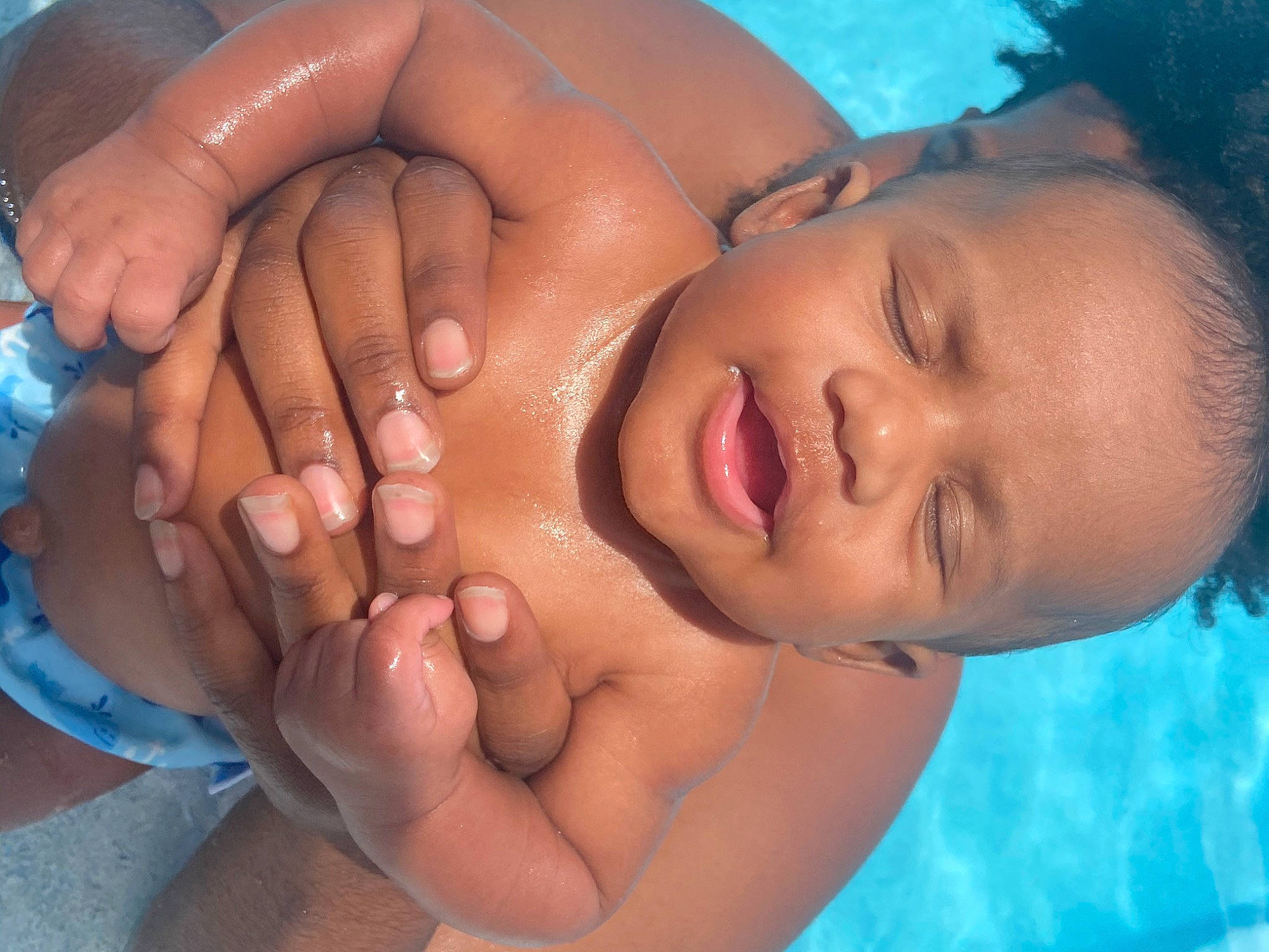 Sekani joined the competition — help win amazing prizes! baby, black_hair, cheek, child, chin, close_up, face, finger, forehead, fun, gesture, hand, lip, mouth, muscle, nail, neck, nose, person, skin