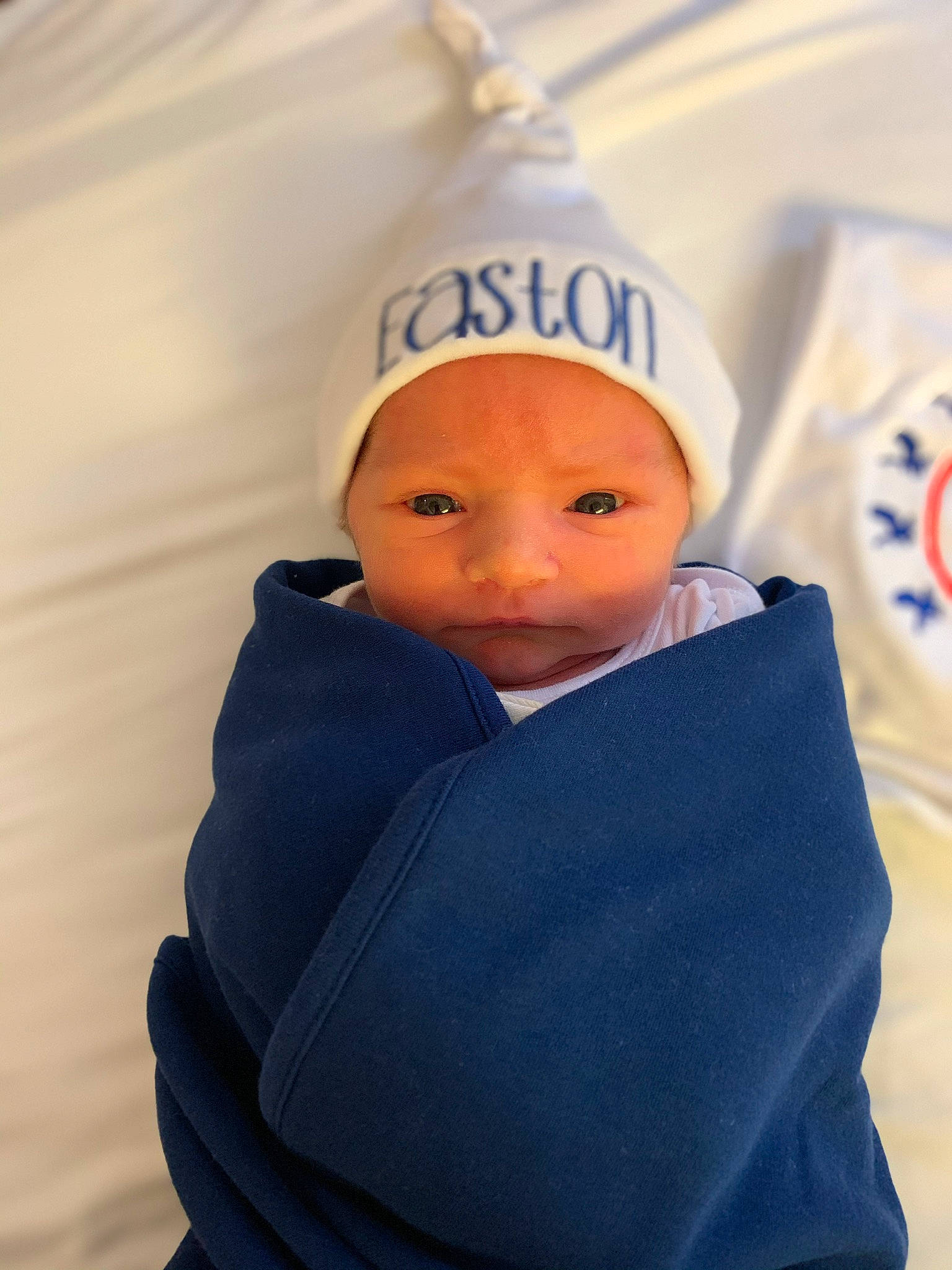 Easton is registered to the contest to win money with this photo: baby, baby_products, beanie, blue, cap, child, head, headgear, headwear, person, product, toddler
