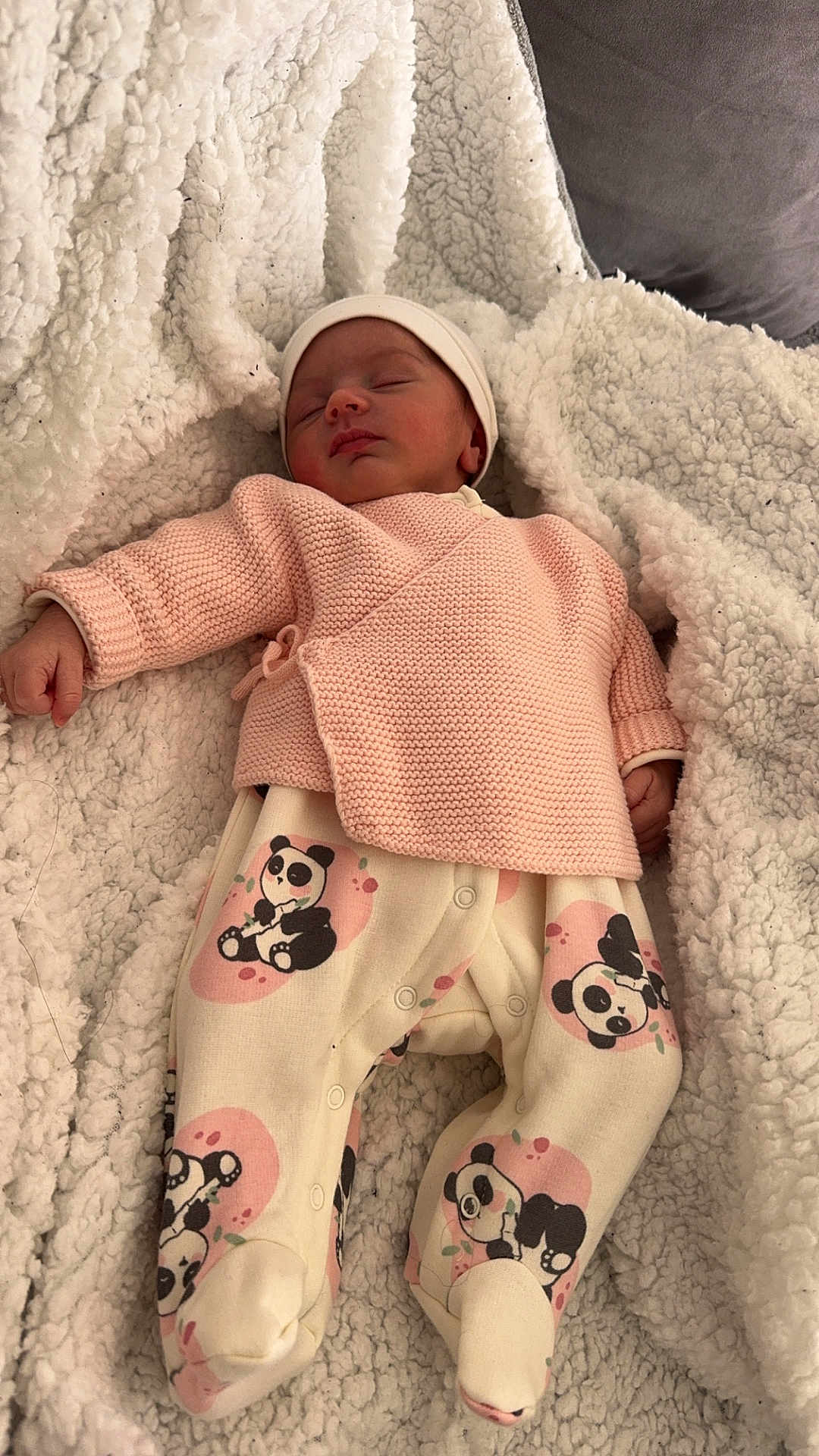 Seyana participe au concours pour gagner de l'argent avec cette photo : baby, newborn, sleeping, blanket, knitted_sweater, panda_print, footed_pants, hat, cozy, soft, cute, infant, clothing, indoors, resting, portrait, child, warm, comfort, peaceful