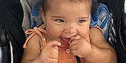 Jersey joined the competition — help win amazing prizes! baby, child, stroller, orange_dress, curly_hair, smiling, playing, fingers, cute, happy, seatbelt, blanket, blue_blanket, toddler, infant, outdoor, person, portrait, fun, casual