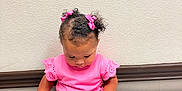 Jersey is registered to the contest to win money with this photo: baby, casual_clothing, child, curious, curly_hair, cute, denim_shorts, floor, hair_bows, indoor, looking_down, pink_shirt, portrait, shorts, sitting, small_child, socks, toddler, wall, white_shoes