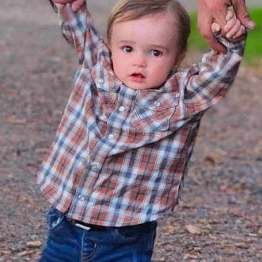 Shane is registered to the contest to win money with this photo: bodypart, boy, child, clothing, face, finger, grass, hand, head, jeans, male, nature, outdoors, pants, park, person, photography, plant, portrait, shirt