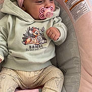 Mahira a rejoint le concours — aidez-le/la à gagner de superbes lots ! baby, infant, pacifier, headband, flower, clothing, bambi, hoodie, pants, socks, baby_seat, cushion, pink, gray, cute, portrait, indoors, child, small_fist, relaxed