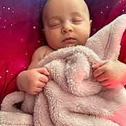 Milani joined the competition — help win amazing prizes! baby, sleeping, blanket, fluffy, cosmic, galaxy, cushion, infant, peaceful, soft, pink, hands, face, closed_eyes, resting, comfort, indoor, portrait, child, cozy