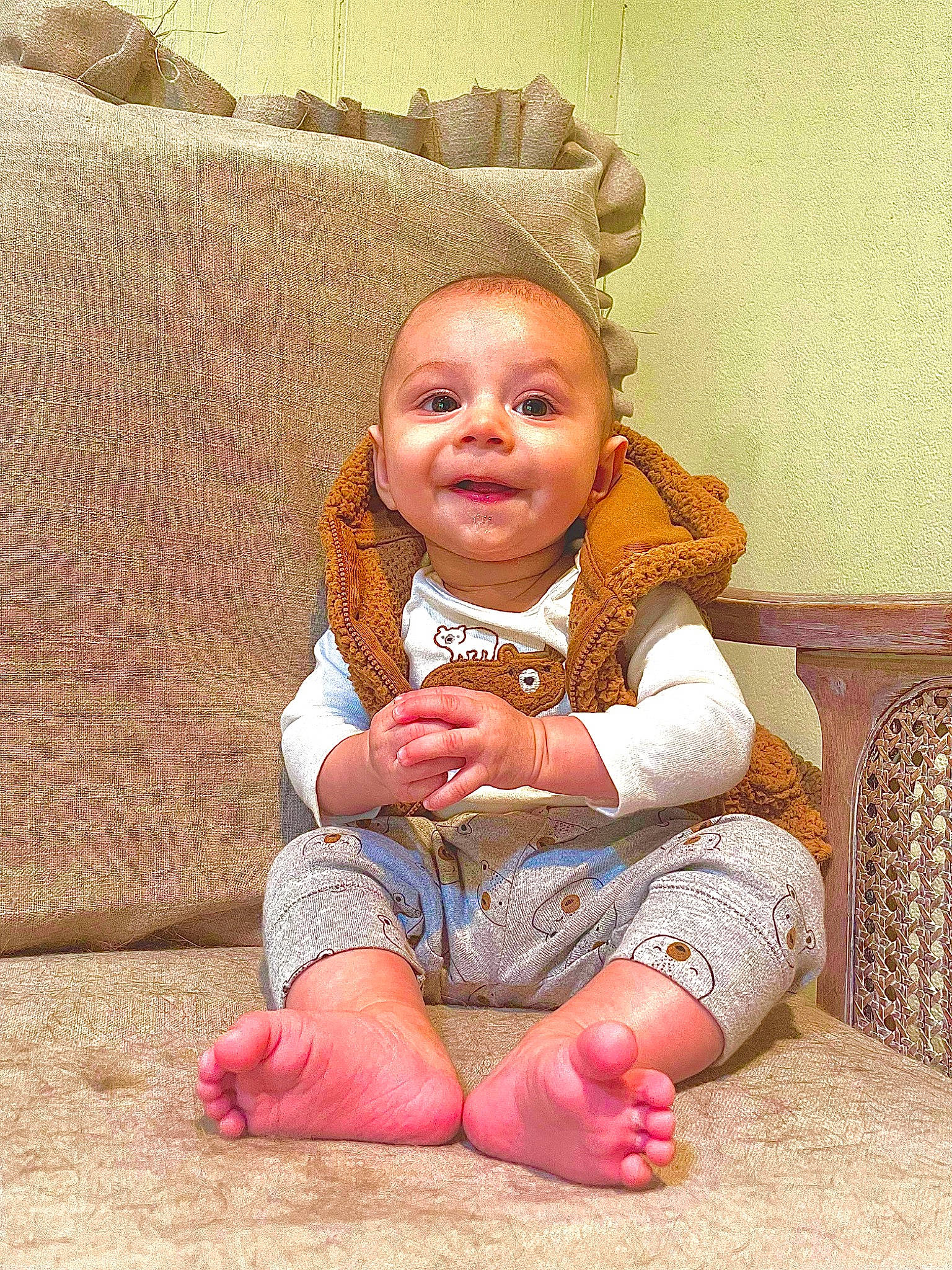 Callum is registered to the contest to win money with this photo: baby, baby_toddler_clothing, cheek, chin, comfort, eye, finger, flooring, foot, happy, head, human_body, human_leg, mouth, nose, person, skin, textile, thumb, toddler