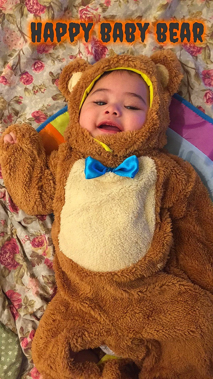 Kymani is registered to the contest to win money with this photo: child, fur, headwear, person, smile, teddy_bear, toddler