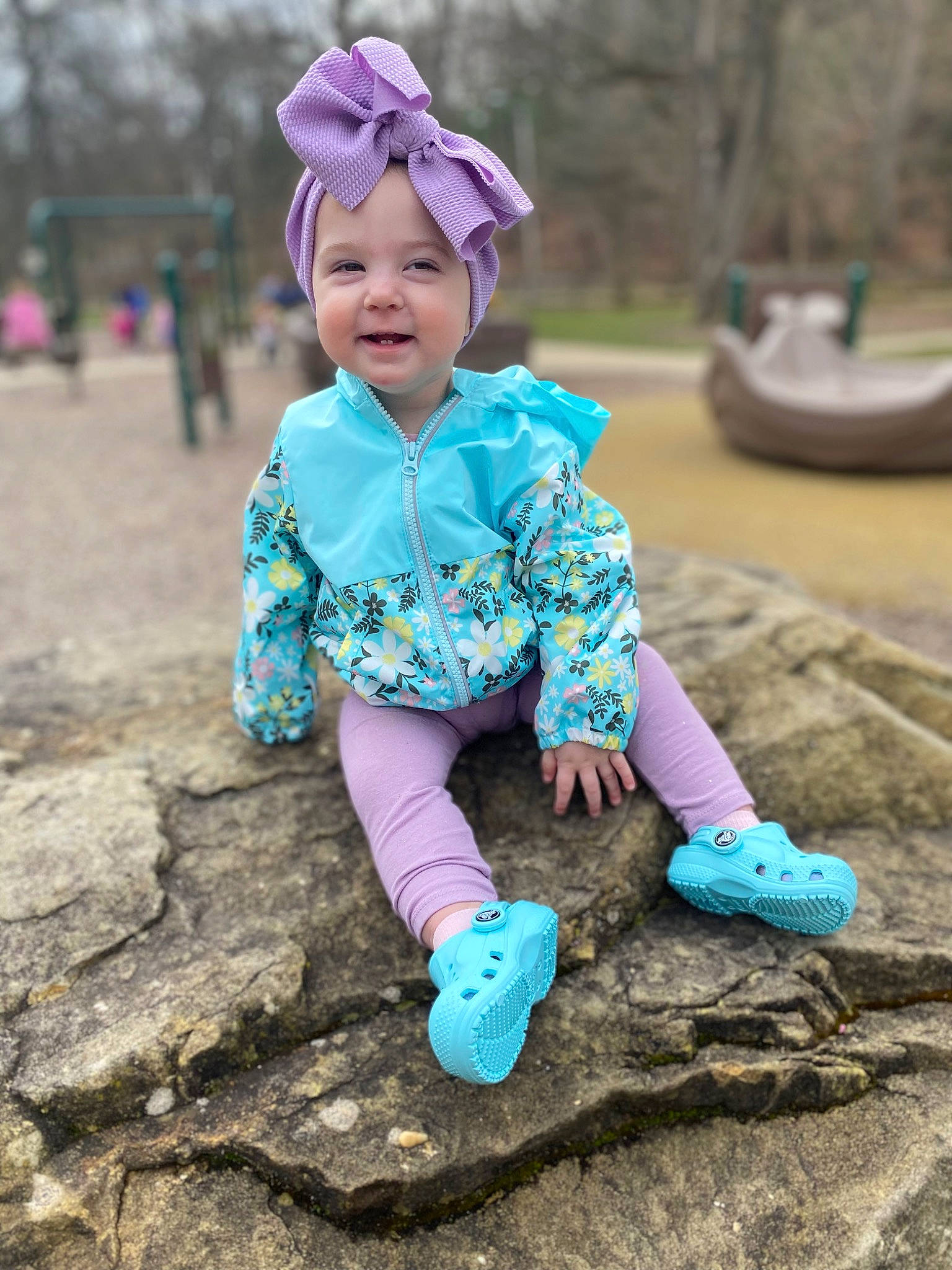 Landry is registered to the contest to win money with this photo: baby_toddler_clothing, beauty, child, face, fun, grass, happy, headwear, leaf, leisure, magenta, nature, people_in_nature, person, pink, public_space, purple, recreation, sleeve, smile