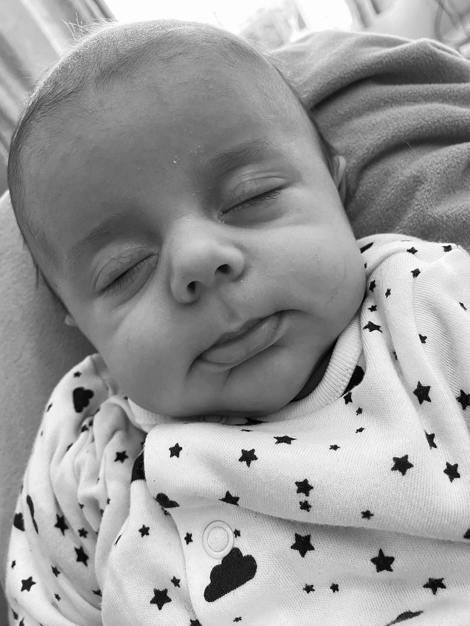 Grayson is registered to the contest to win money with this photo: baby, beauty, black, cheek, child, collar, comfort, eyelash, facial_expression, happy, human, monochrome, monochrome_photography, pattern, person, photograph, portrait_photography, sleeve, smile, toddler