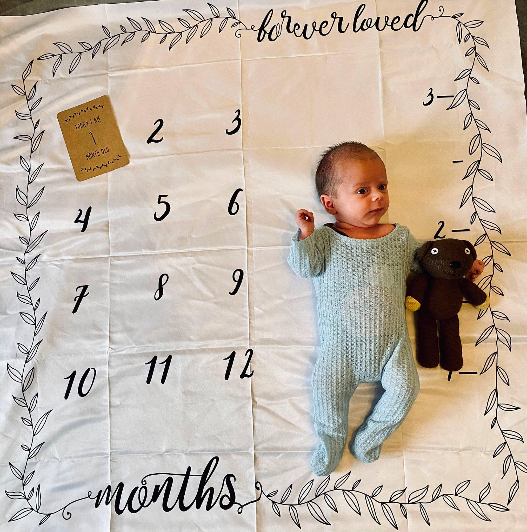 Grayson is registered to the contest to win money with this photo: baby, baby_toddler_clothing, child, font, handwriting, happy, illustration, number, paper, paper_product, pattern, person, photo_caption, rectangle, room, sleeve, smile, toddler, writing
