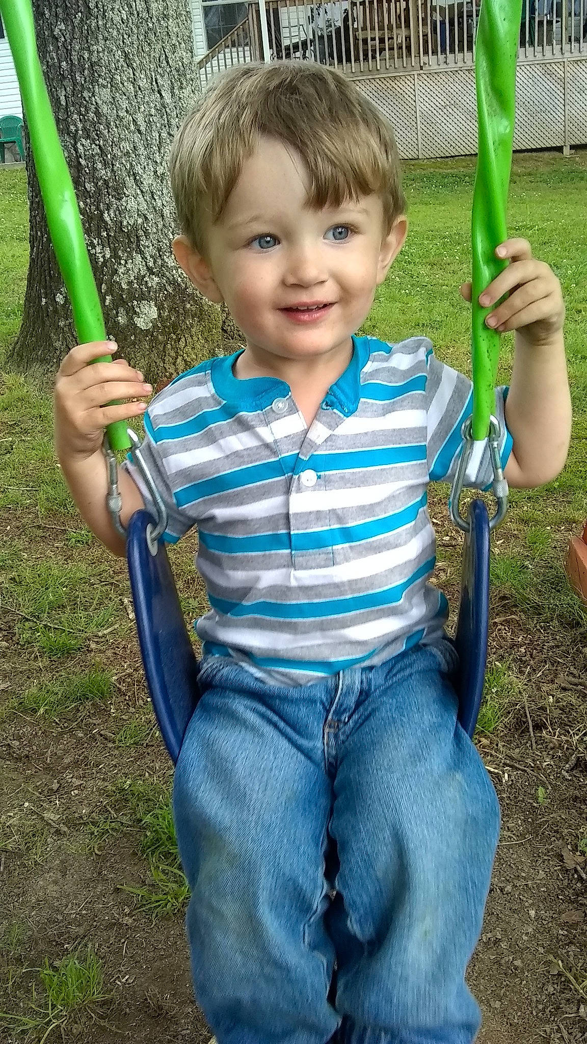 Coty Jr is registered to the contest to win money with this photo: child, fun, jeans, joy, outdoor_play_equipment, person, play, playground, public_space, recreation, smile, swing, toddler