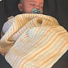 baby, infant, sleeping, pacifier, blanket, striped_blanket, car_seat, child, portrait, indoors, cozy, resting, closed_eyes, bald, head, face,  안전, nursery, travel, nap