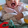 activity_seat, baby, bib, blanket, bokeh, camera_watermark, cheeks, closeup, eyes, floral_pattern, hands, happy, indoor, infant, open_mouth, portrait, smiling, teether, tongue, toy_ball