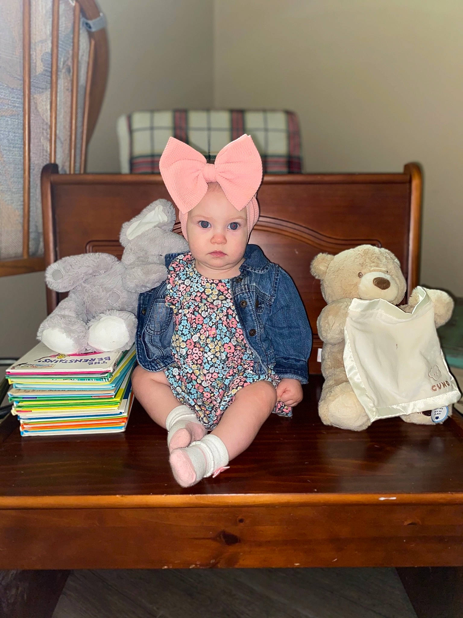 Harlee joined the competition — help win amazing prizes! baby, baby_toddler_clothing, cap, chair, child, comfort, doll, eye, fedora, hat, headgear, headwear, human_body, person, sleeve, sock, stuffed_toy, table, textile, thigh