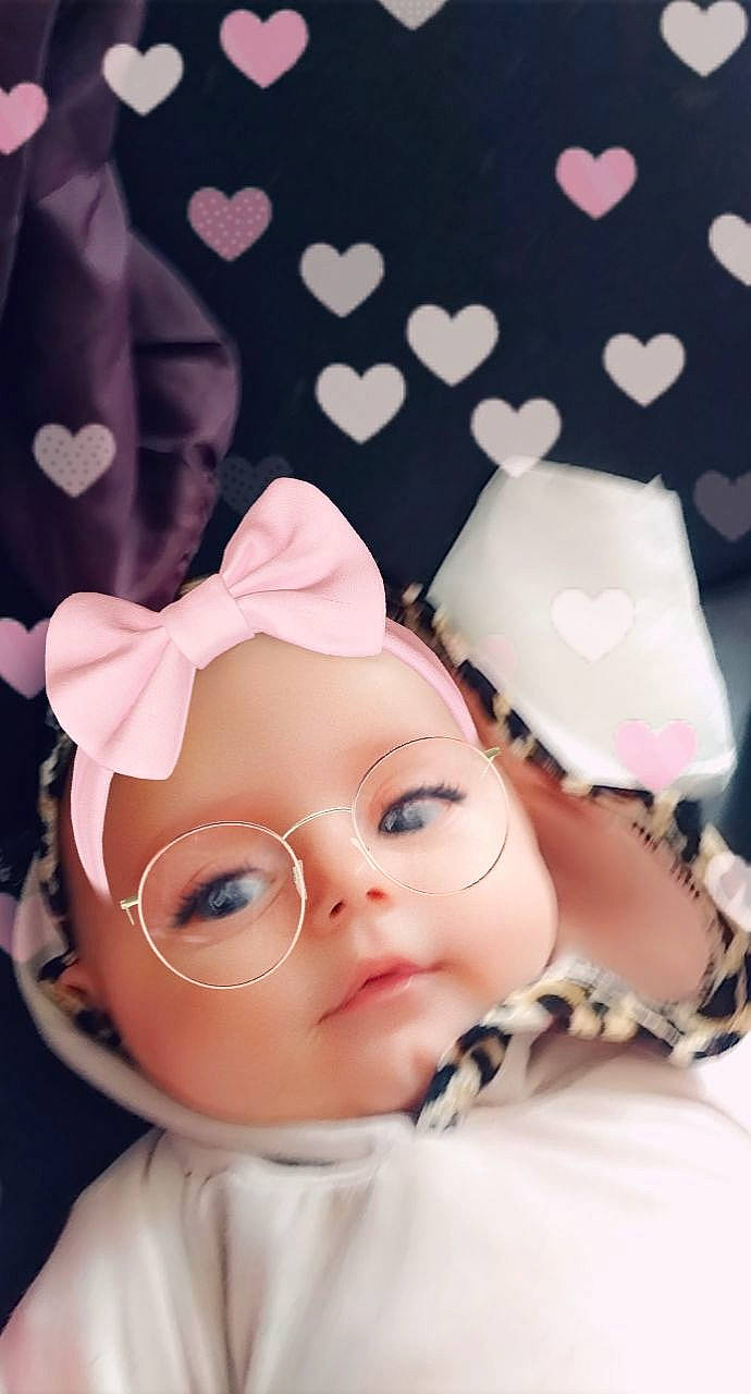 Mmya participe au concours pour gagner de l'argent avec cette photo : art, cheek, child, doll, eye, eyelash, fashion_accessory, fictional_character, figurine, happy, head, headwear, pattern, peach, person, pink, portrait_photography, textile, toy, white