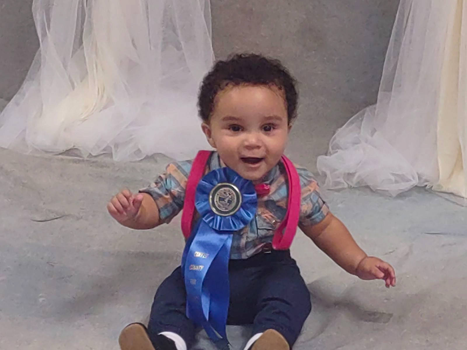 Atticus joined the competition — help win amazing prizes! baby, baby_toddler_clothing, child, comfort, eye, flash_photography, flooring, fun, happy, human, leg, leisure, people, person, play, sitting, skin, smile, t_shirt, toddler