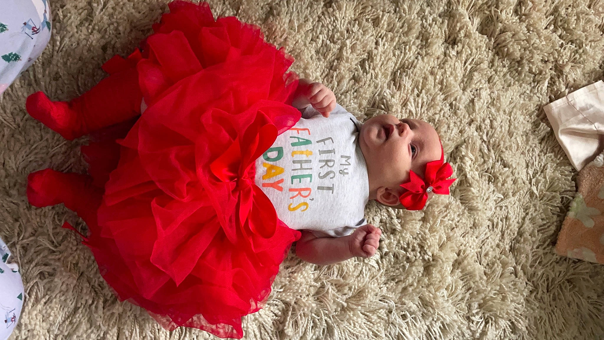 Gracie-mai is registered to the contest to win money with this photo: arm, baby, baby_toddler_clothing, child, dress, face, fun, grass, happy, head, leaf, leisure, people_in_nature, person, petal, play, recreation, sitting, skin, soil