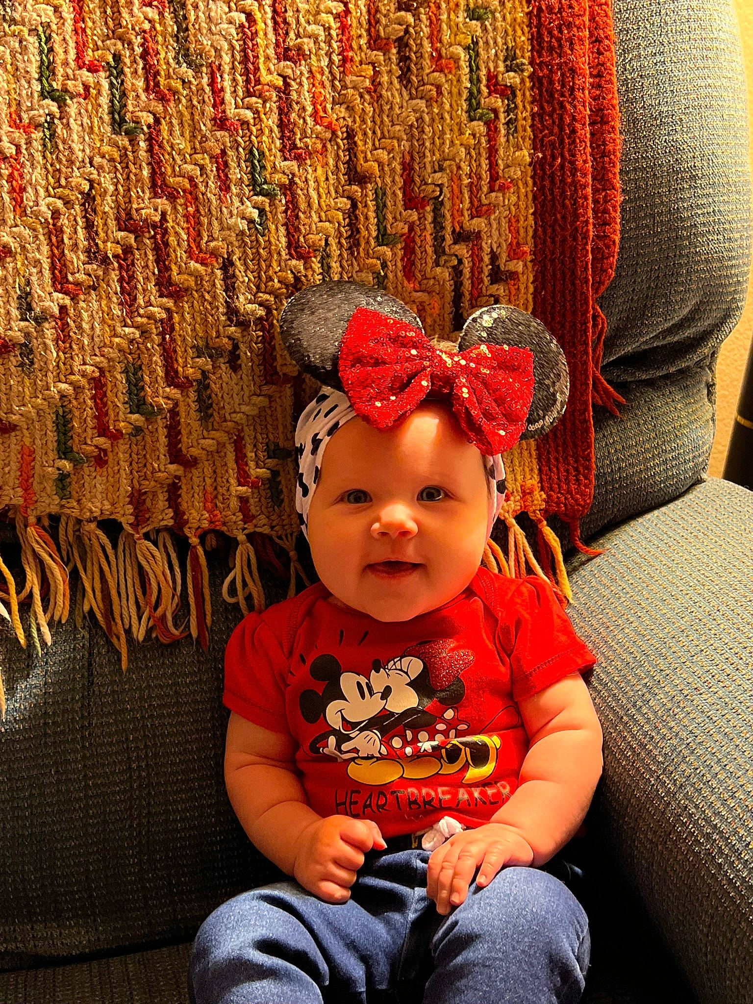 Madilyn joined the competition — help win amazing prizes! baby, baby_toddler_clothing, cap, child, costume_hat, fashion_accessory, flash_photography, fun, happy, headgear, headwear, knit_cap, magenta, party_supply, pattern, person, red, room, sitting, toddler