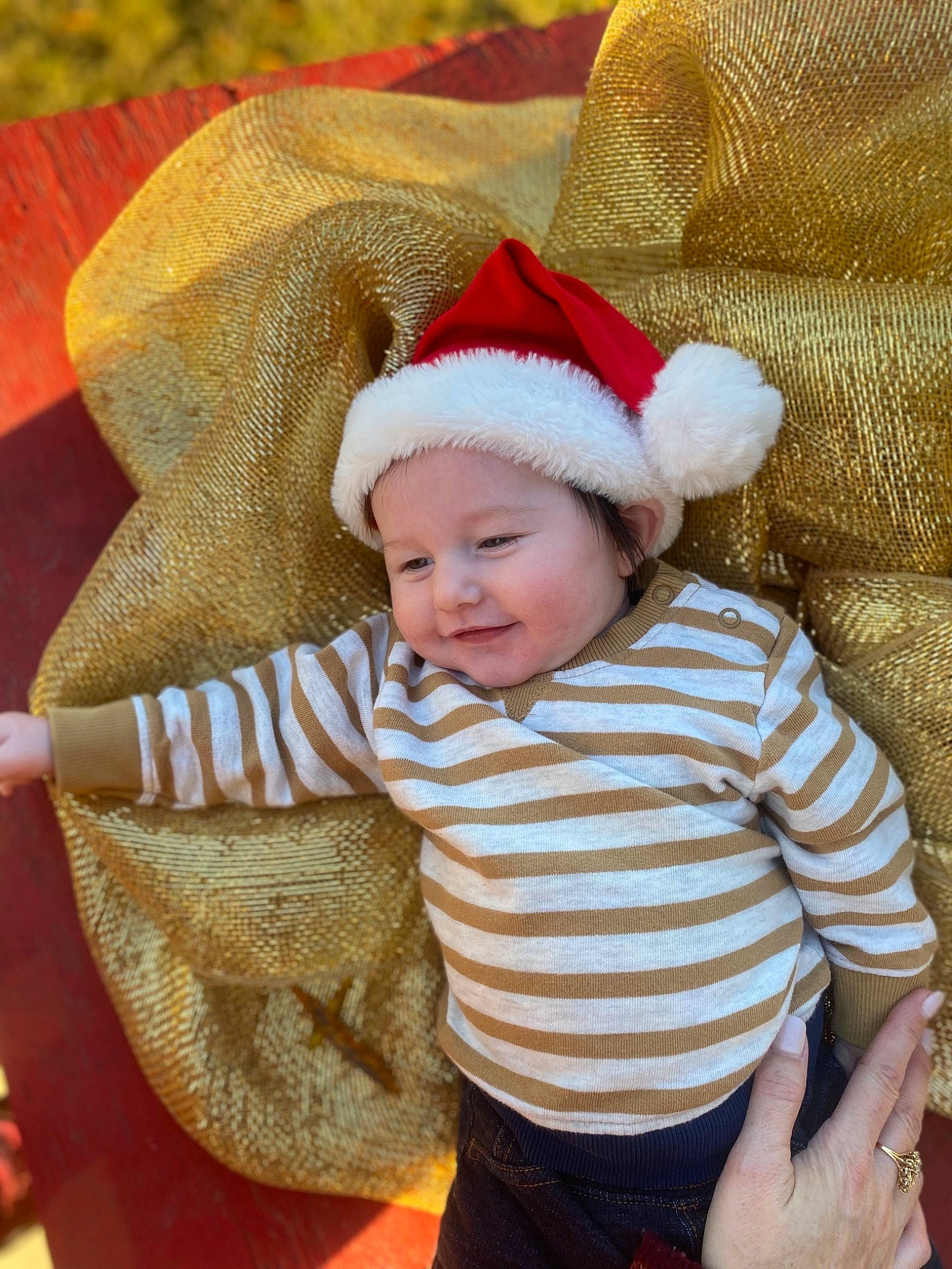Colton joined the competition — help win amazing prizes! baby, baby_toddler_clothing, child, comfort, costume_hat, eye, face, happy, head, headgear, headwear, human_body, outerwear, person, red, skin, sleeve, smile, textile, toddler