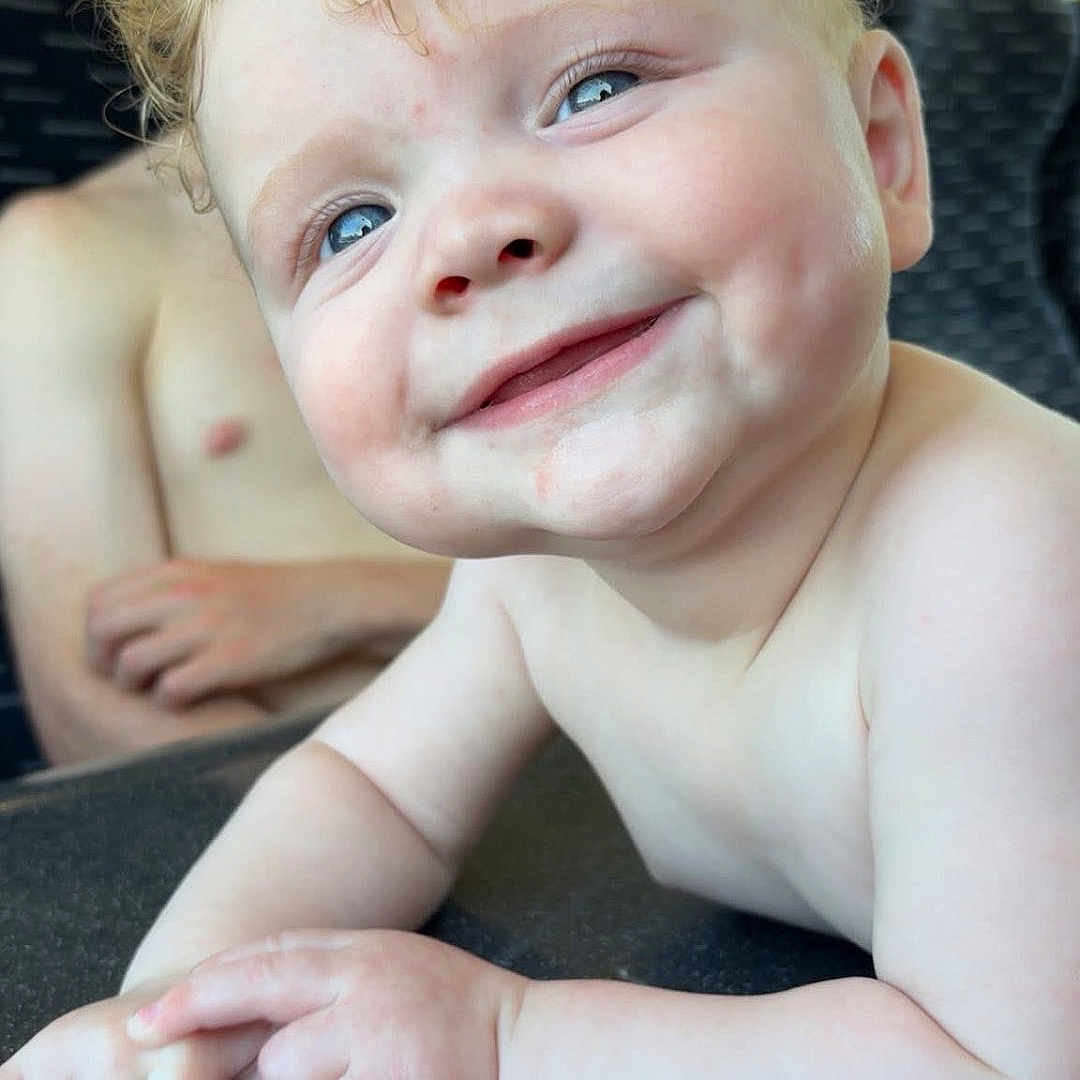Kyro joined the competition — help win amazing prizes! baby, background, blue_eyes, child, close_up, curly_hair, cute, face, hands, happy, indoor, natural_light, person, portrait, seat, sibling, skin, smiling, table, window