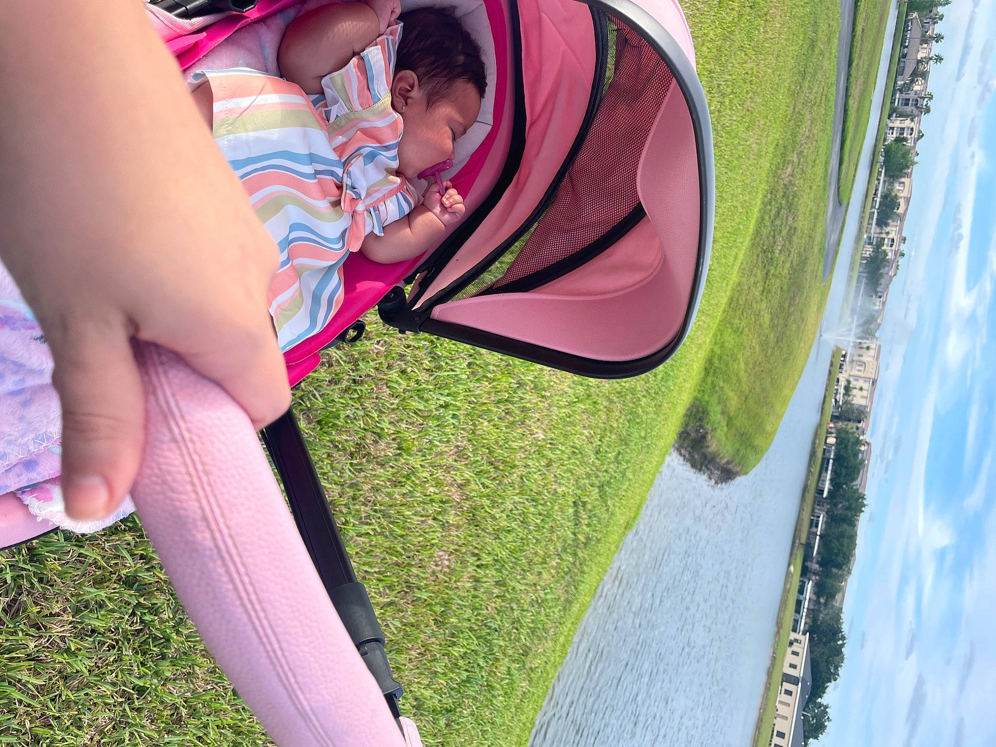 Avery is registered to the contest to win money with this photo: baby, eyewear, fun, grass, happy, human_leg, knee, leisure, magenta, people_in_nature, person, pink, plant, recreation, sky, summer, thigh, tints_and_shades, toddler, vehicle_door