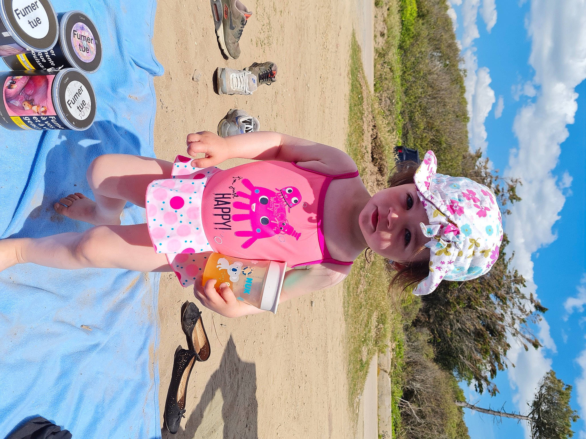 Shaïna a rejoint le concours — aidez-le/la à gagner de superbes lots ! blue, child, cloud, fun, happy, hat, headwear, leisure, person, pink, plant, recreation, shorts, sky, summer, t_shirt, toddler, travel, tree, vacation