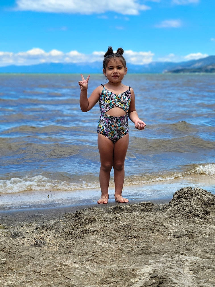Namiko is registered to the contest to win money with this photo: azure, beach, brassiere, cloud, coastal_and_oceanic_landforms, fun, happy, human_body, leg, people_in_nature, people_on_beach, person, sand, sky, swimsuit_top, swimwear, thigh, trunk, undergarment, waist