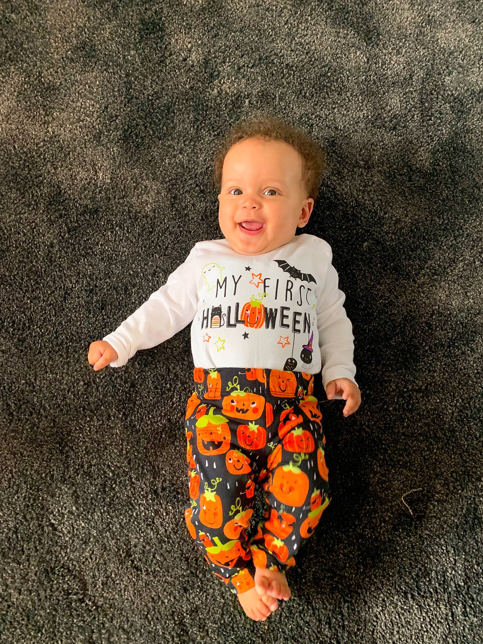 Amariah is registered to the contest to win money with this photo: baby, baby_products, baby_toddler_clothing, child, orange, outerwear, pattern, person, plant, product, sleeve, t_shirt, toddler