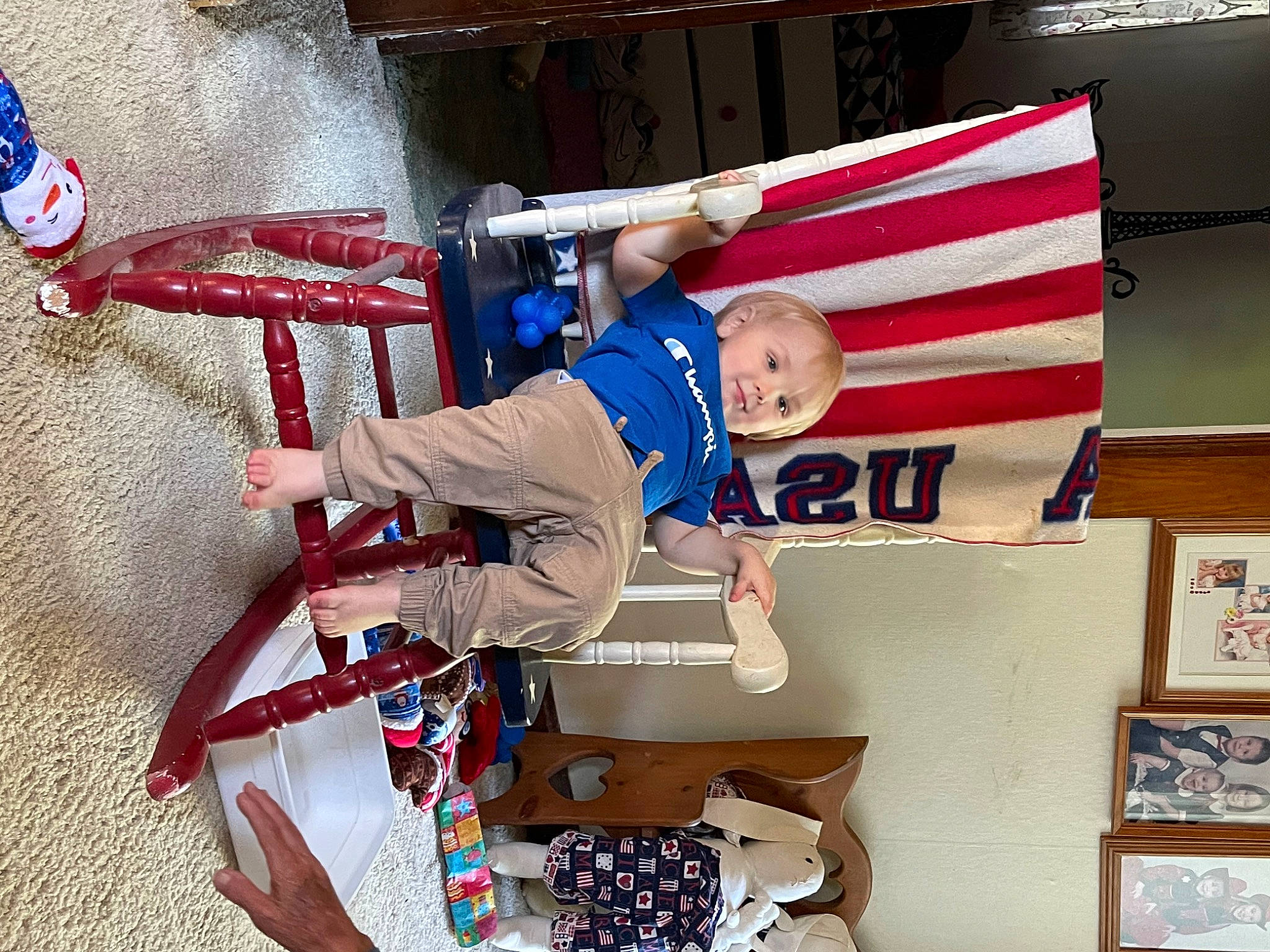 Kobe is registered to the contest to win money with this photo: baby, blurred, carmine, child, electric_blue, event, flag, flag_of_the_united_states, fun, happy, person, room, smile, t_shirt, toddler, walking_shoe
