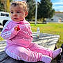 Kylie joined the competition — help win amazing prizes! toddler, child, pink_tracksuit, socks, outdoor, picnic_table, daylight, curious, park, greenery, soft_light, casual_clothing, baby, cute, sitting, nature, trees, wood, relaxed, portrait