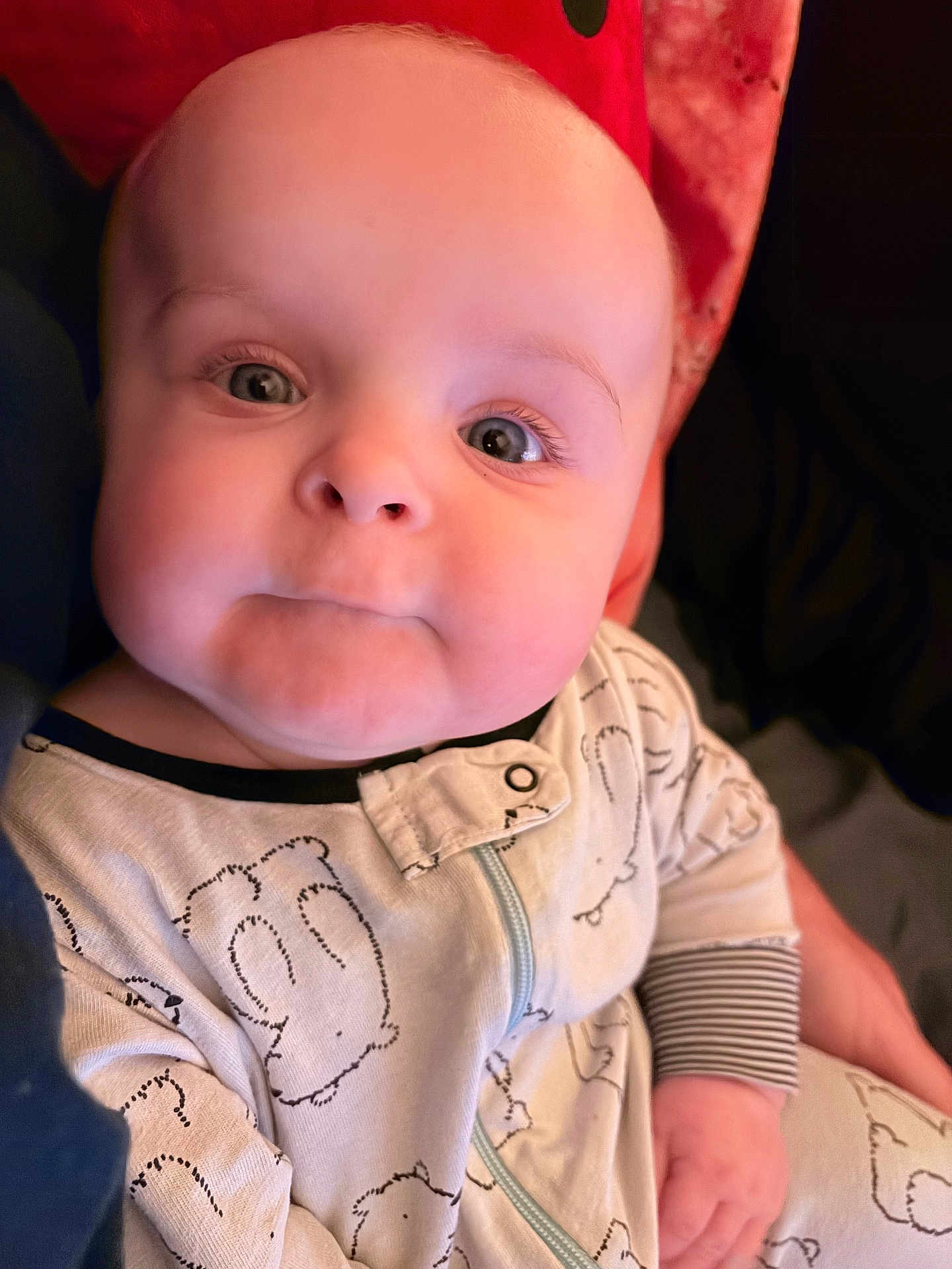 Nikolai is registered to the contest to win money with this photo: baby, child, face, onesie, clothing, hand, person, infant, cute, expression, cheeks, eyes, portrait, young, sleepwear, home, soft, comfort, holding, closeup