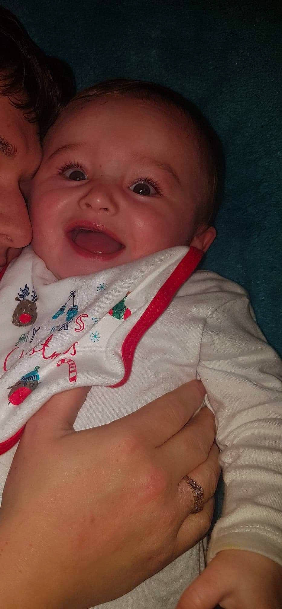 Hardy is registered to the contest to win money with this photo: baby, cheek, child, facial_expression, finger, lip, mouth, nose, person, skin, smile, toddler