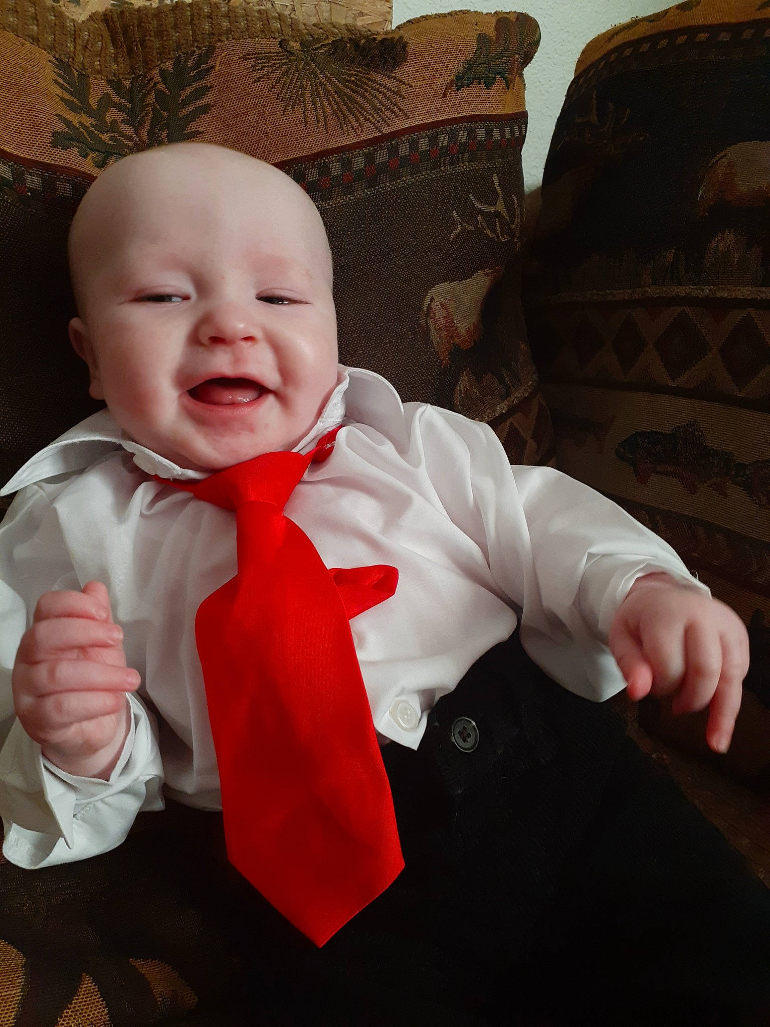 Brantley joined the competition — help win amazing prizes! baby, cheek, child, eye, face, facial_expression, finger, fun, hand, happy, head, lip, mouth, nose, person, product, red, skin, smile, tie